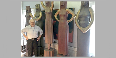 Reuben Hale posing next to his Caryatids